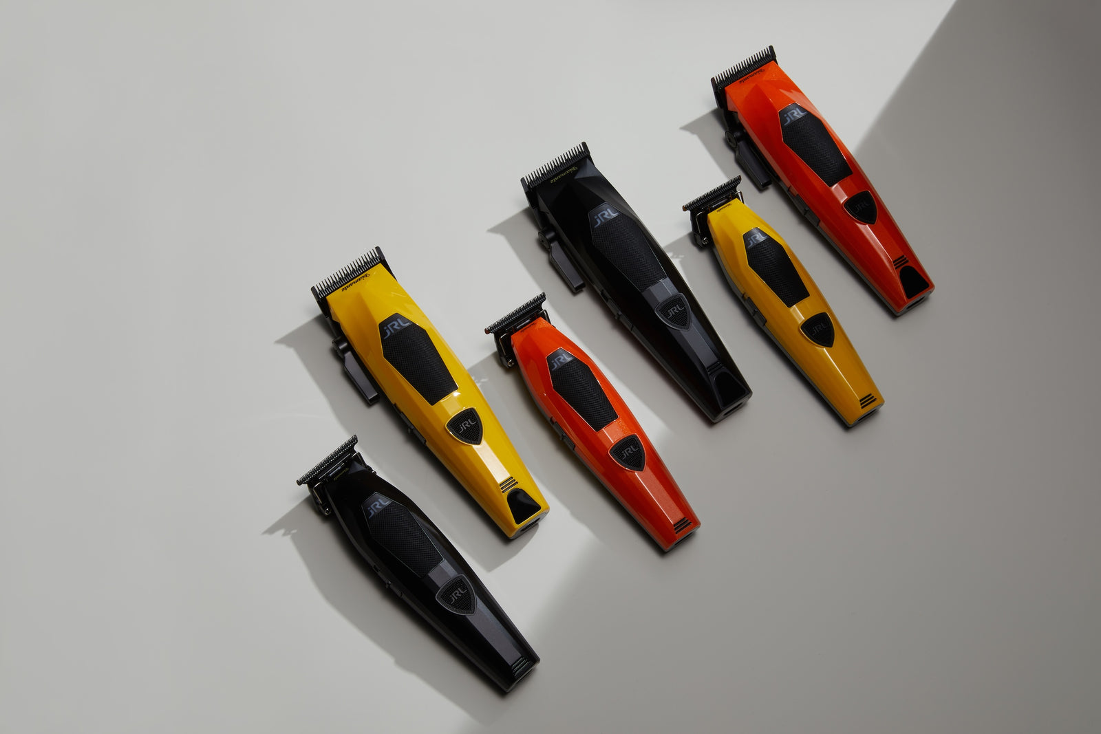 JRL Diamante klippmaskiner och trimmers i gult, orange och svart, sedda uppifrån